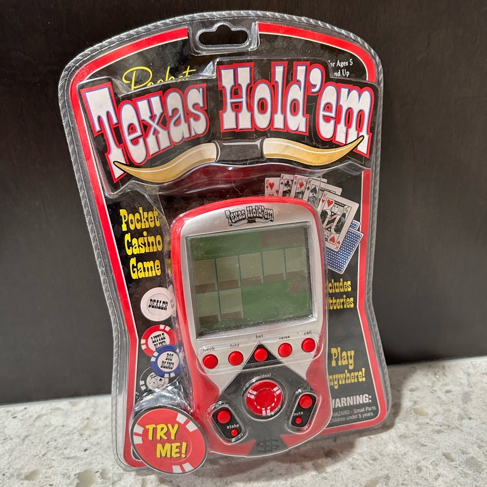 New in Package Texas Hold’em Hand Held Game  Slight Package Damage. See photo.